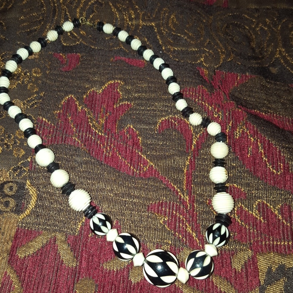Woman's black and cream beaded necklace.